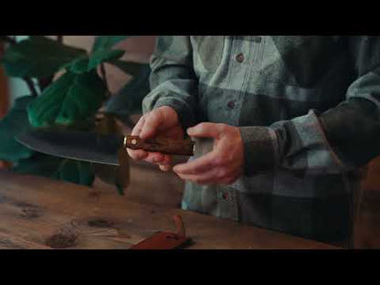 Roselli's handcrafted Gyuto kitchen knife in high-carbon steel (UHC steel) with a stained curly birch handle. Delivered with a handmade leather sheath.